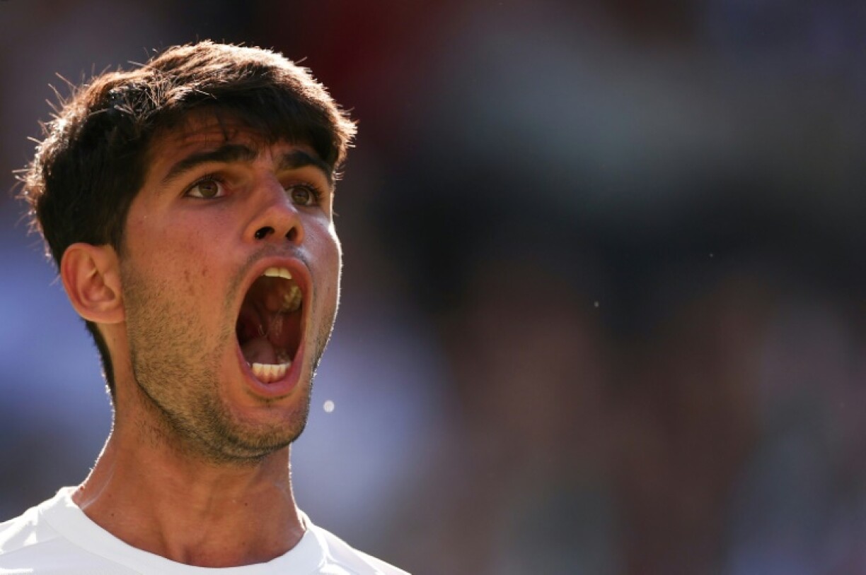 Carlos Alcaraz celebrates during his Wimbledon opener against Fabio Fognini