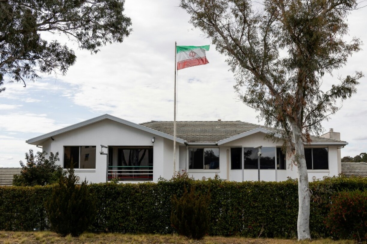 The Iranian national flag flies over the country's embassy building in Canberra on Tuesday
