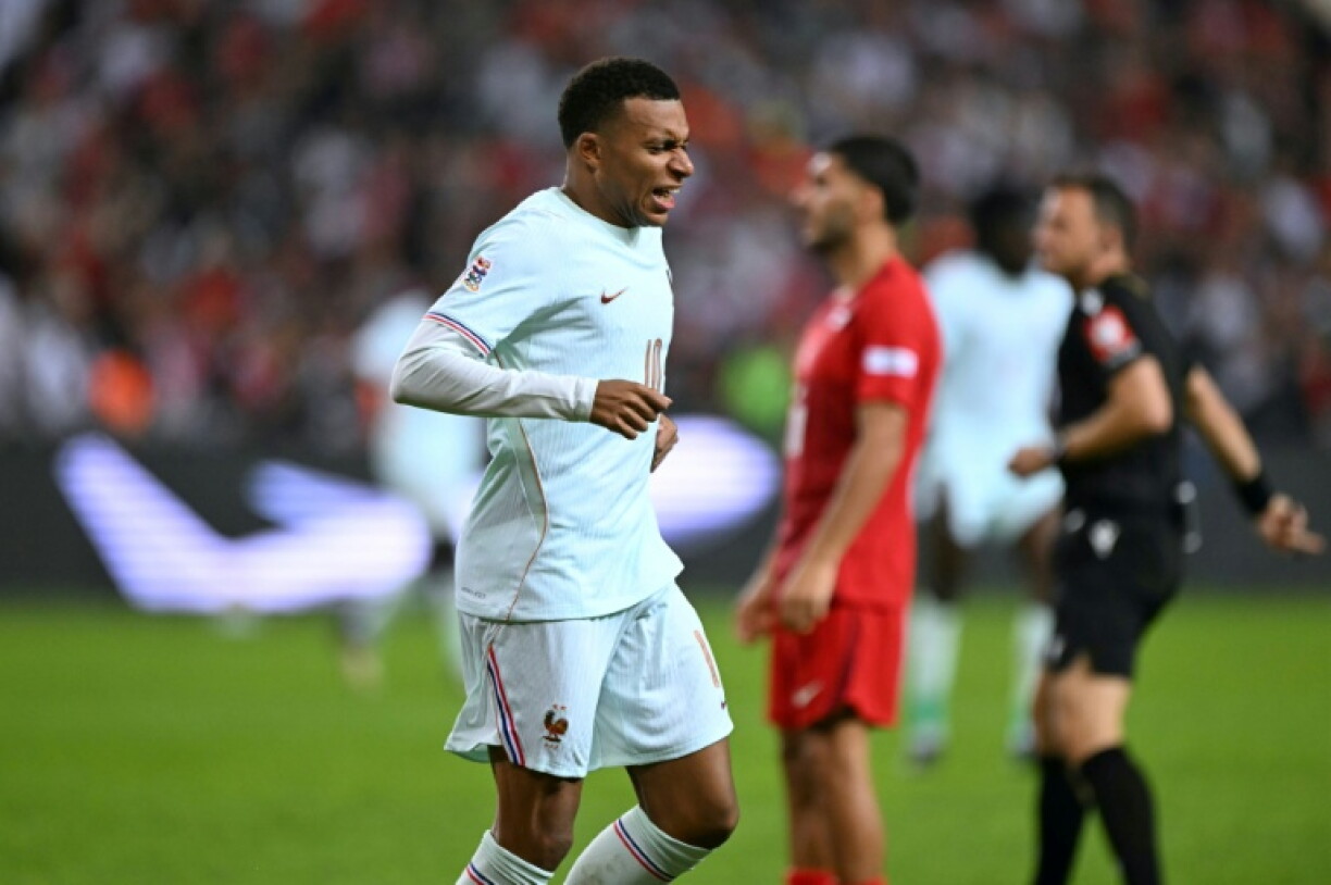 Kylian Mbappe winces after scoring against Turkey