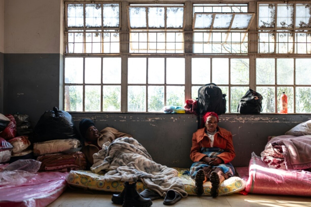 Displaced residents at a temporary shelter in a school