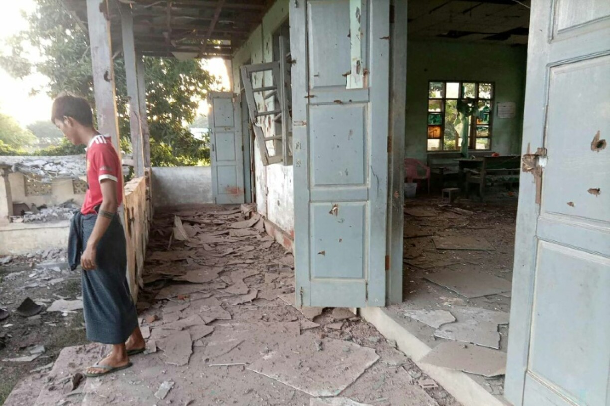 This UGC photo courtesy of Facebook user Yebaw Hlyat Cee taken on October 7, 2025 and received on October 8 shows damage to a building next to the site of a military strike on a protest in central Myanmar's Chaung U township