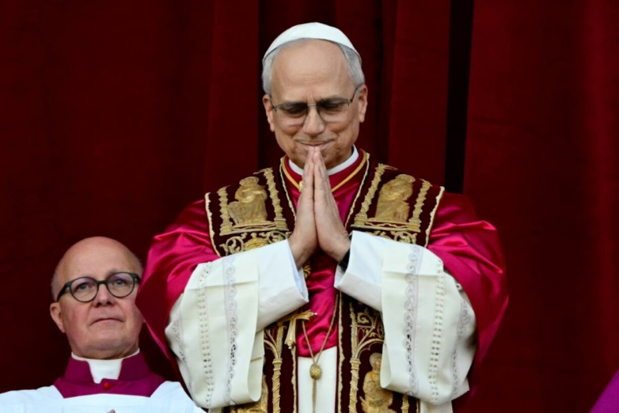 Newly elected Pope Leo XIV addresses the crowd from the balcony of the St Peter's Basilica for the first time