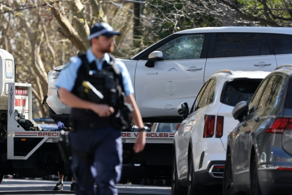 A tow truck removes a car after it was driven into the gates of the Russian consulate in Sydney on September 1, 2025