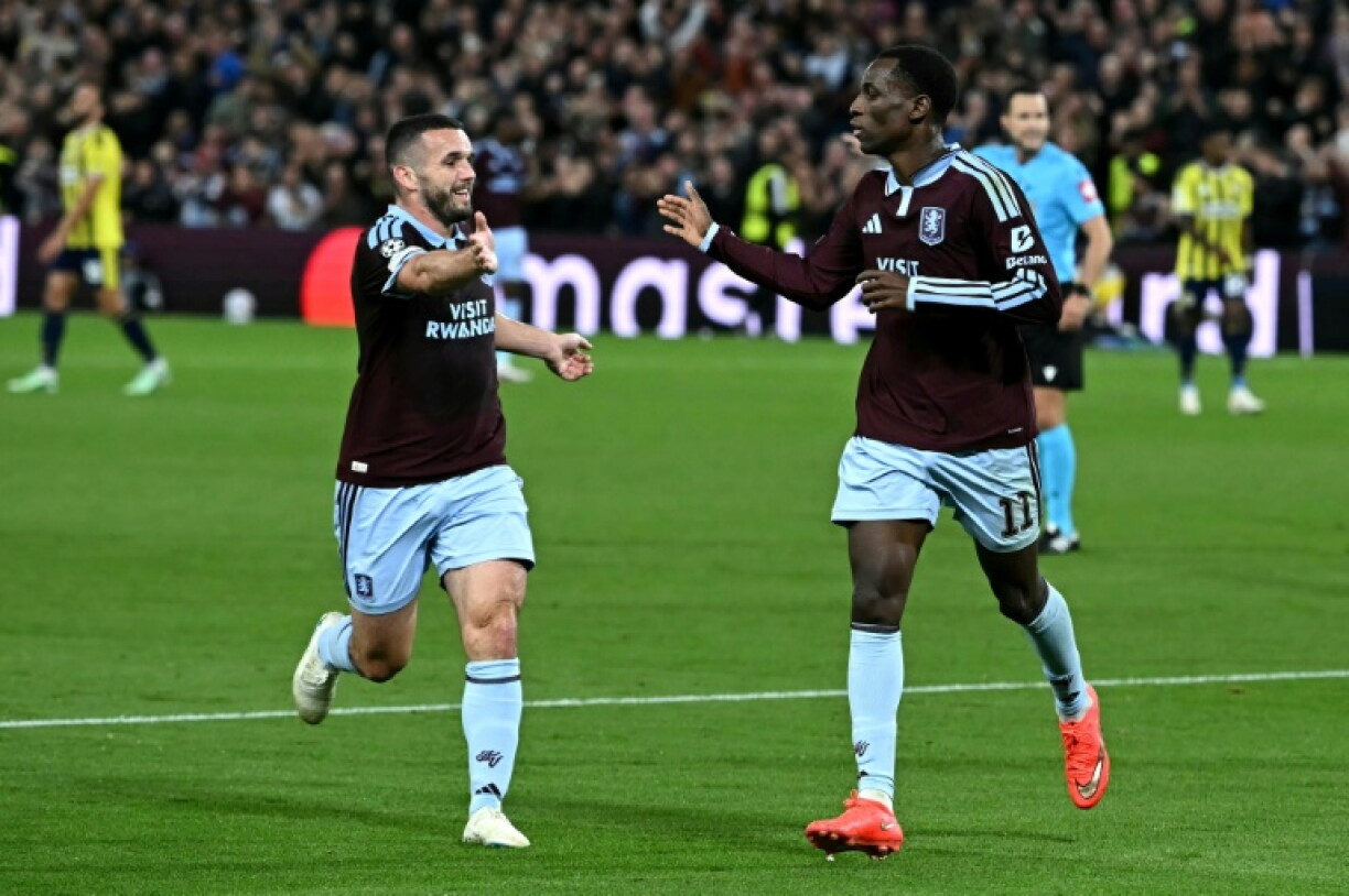 Aston Villa striker Nicolas Jackson (R) celebrates scoring against Fenerbahce