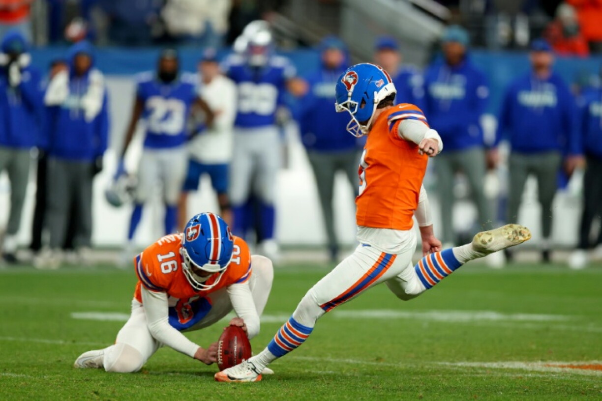 Denver's Wil Lutz kicks the game-winning field goal in the Broncos' NFL overtime victory over the Super Bowl champion Seattle Seahawks