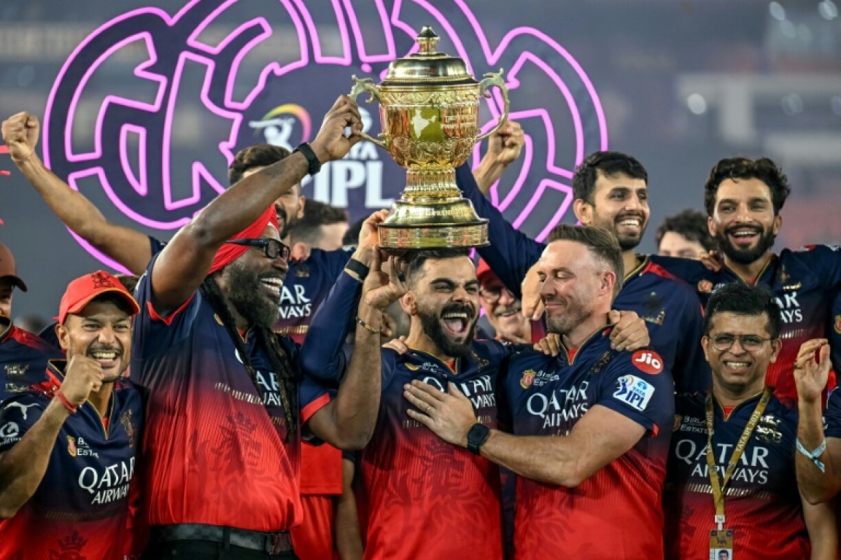 Virat Kohli (centre) celebrates winning the IPL with Bengaluru teammates