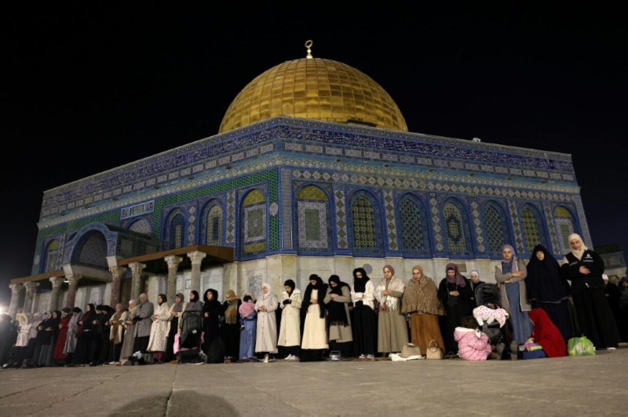 Palestinian Muslims hold eve-of-Ramadan prayers outside the Dome of the Rock in Israeli-annexed east Jerusalem.