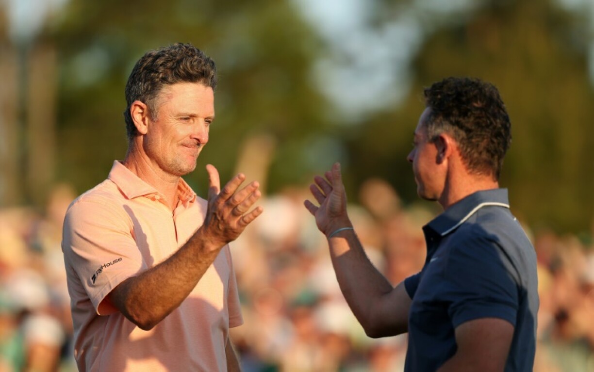 England's Justin Rose congratulates Rory McIlroy after falling to the Northern Ireland star in a playoff at the Masters