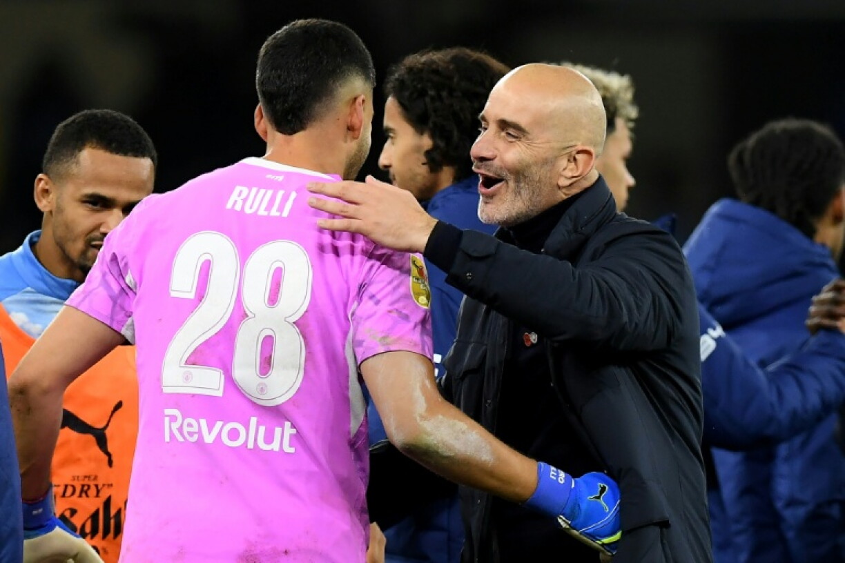 Manchester City manager Enzo Maresca hugs goalkeeper Geronimo Rulli