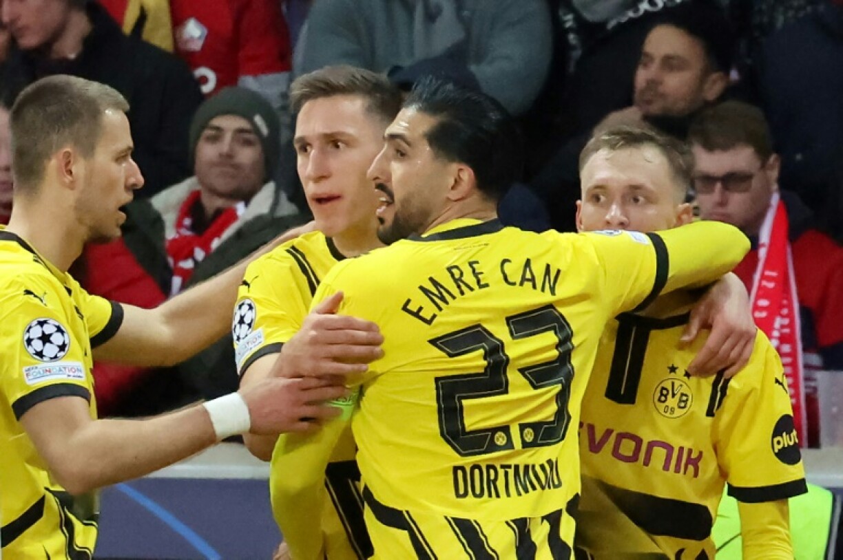 Borussia Dortmund came from behind to beat Lille 2-1 in France on Wednesday and win their Champions League last-16 tie 3-2 on aggregate