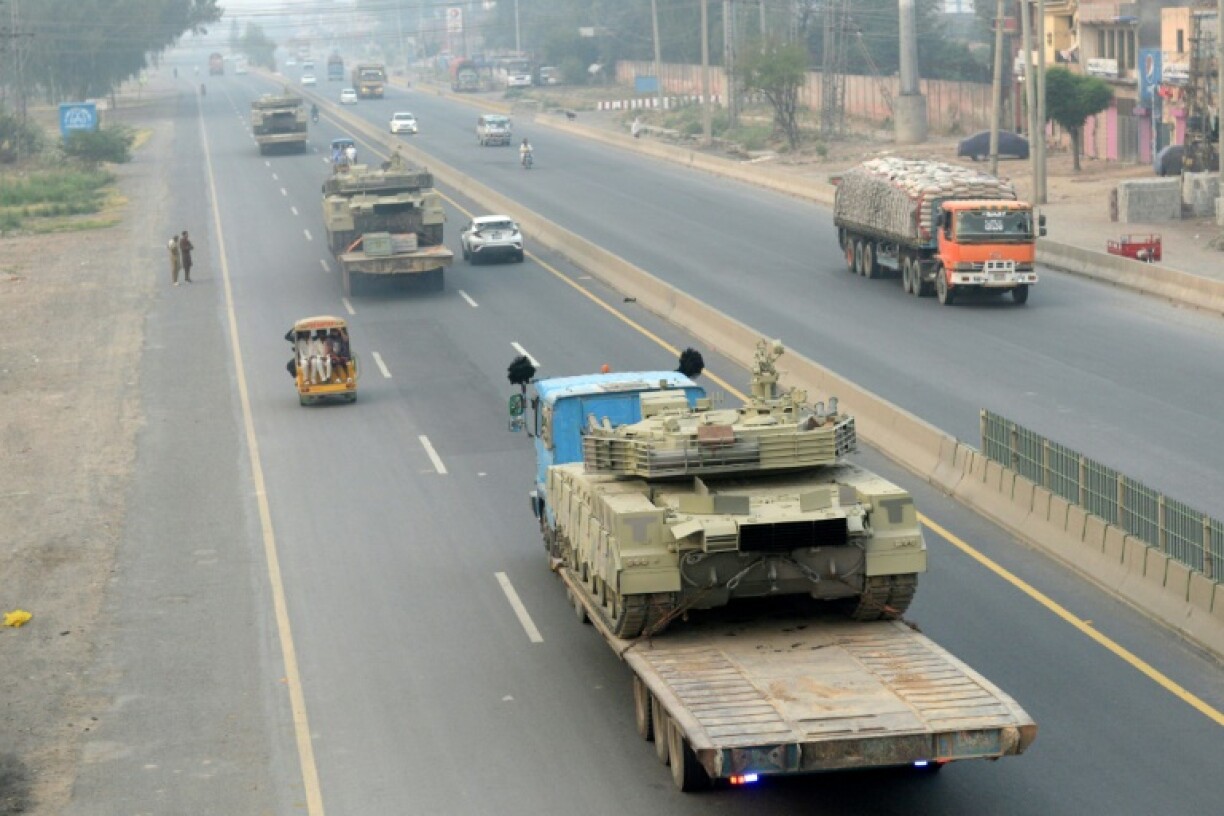 Trucks transport army tanks on a road in Muridke, about 30 kilometres from Lahore, on May 7, 2025