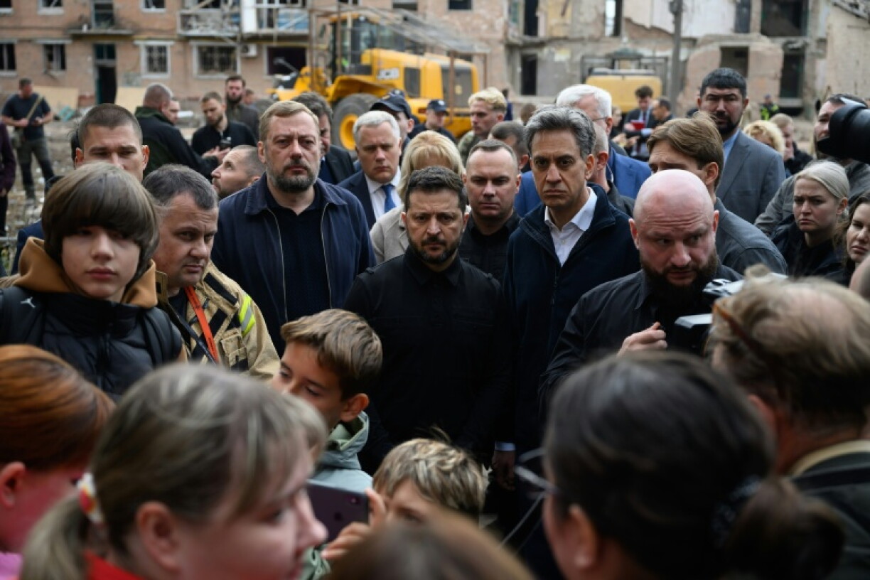 Ukraine's President Volodymyr Zelensky and UK foreign minister Ed Miliband visited the site of a Russian strike in Prluky