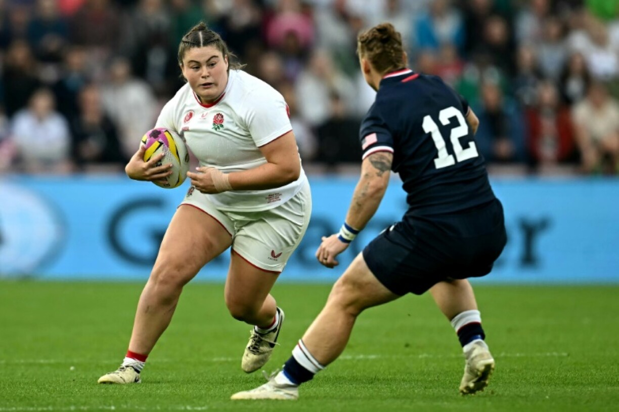 Amy Cokayne runs at Alev Kelter during England's tournament-opening 69-7 win over the United States in Sunderland