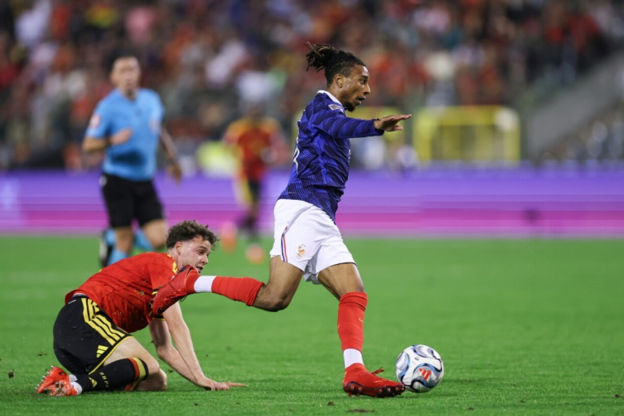 Michael Olise leaves the Belgian defence behind on his way to scoring France's winner