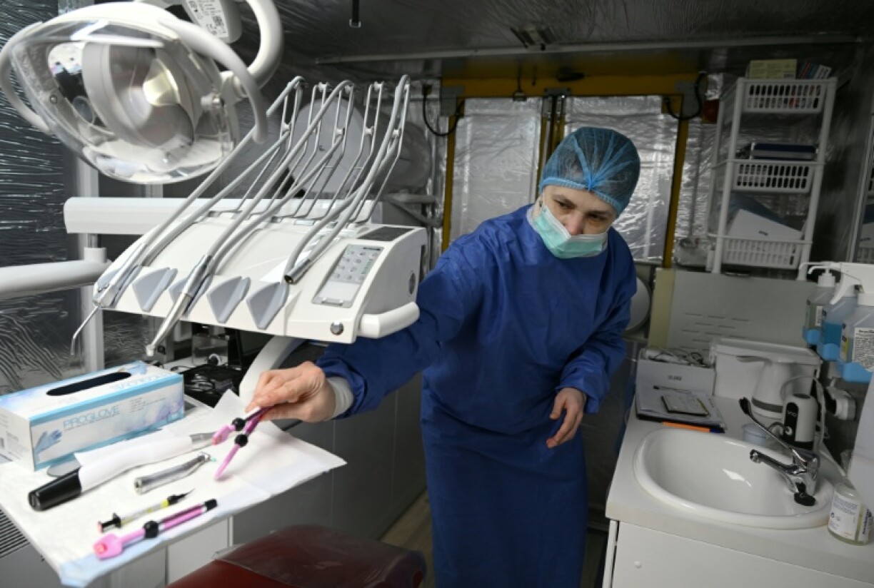 Olga, who serves in the army with her daughter Maria, prepares instruments in a mobile dental clinic in an undisclosed location in the Kharkiv region