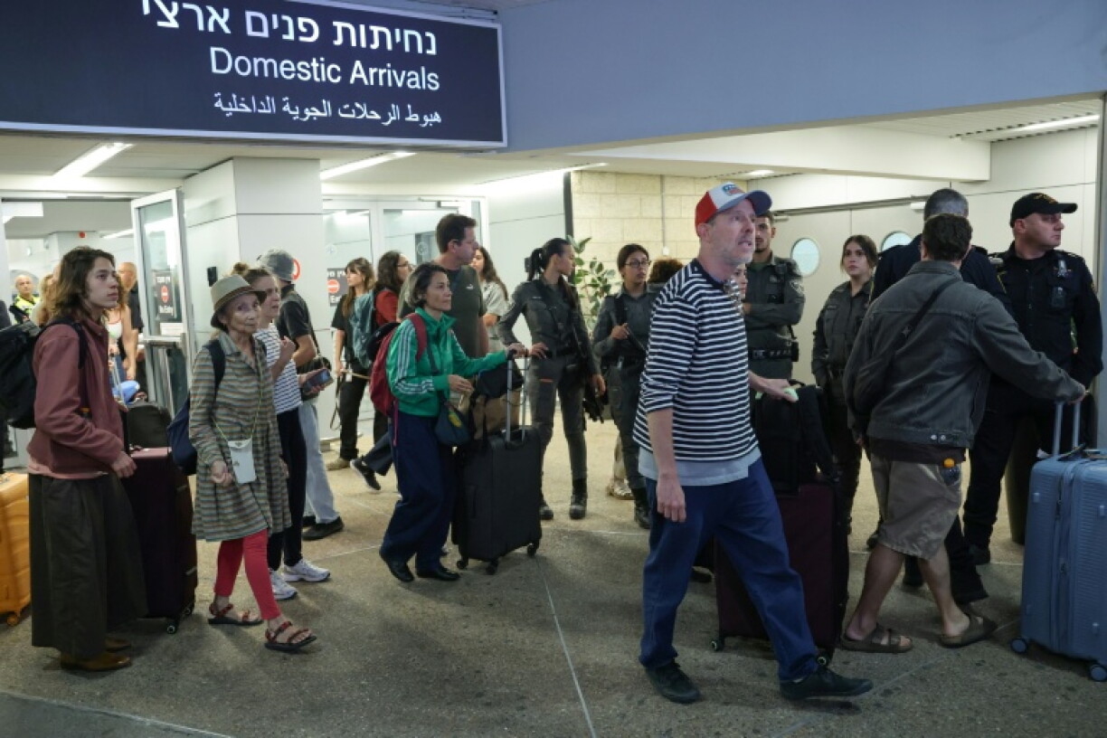 Passengers landed at Israel's Ben Gurion Airport after the their earlier flight was diverted to Saudi Arabia following what Prime Minister Benjamin Netanyahu described as an attempt by one of the pilots to crash the plane