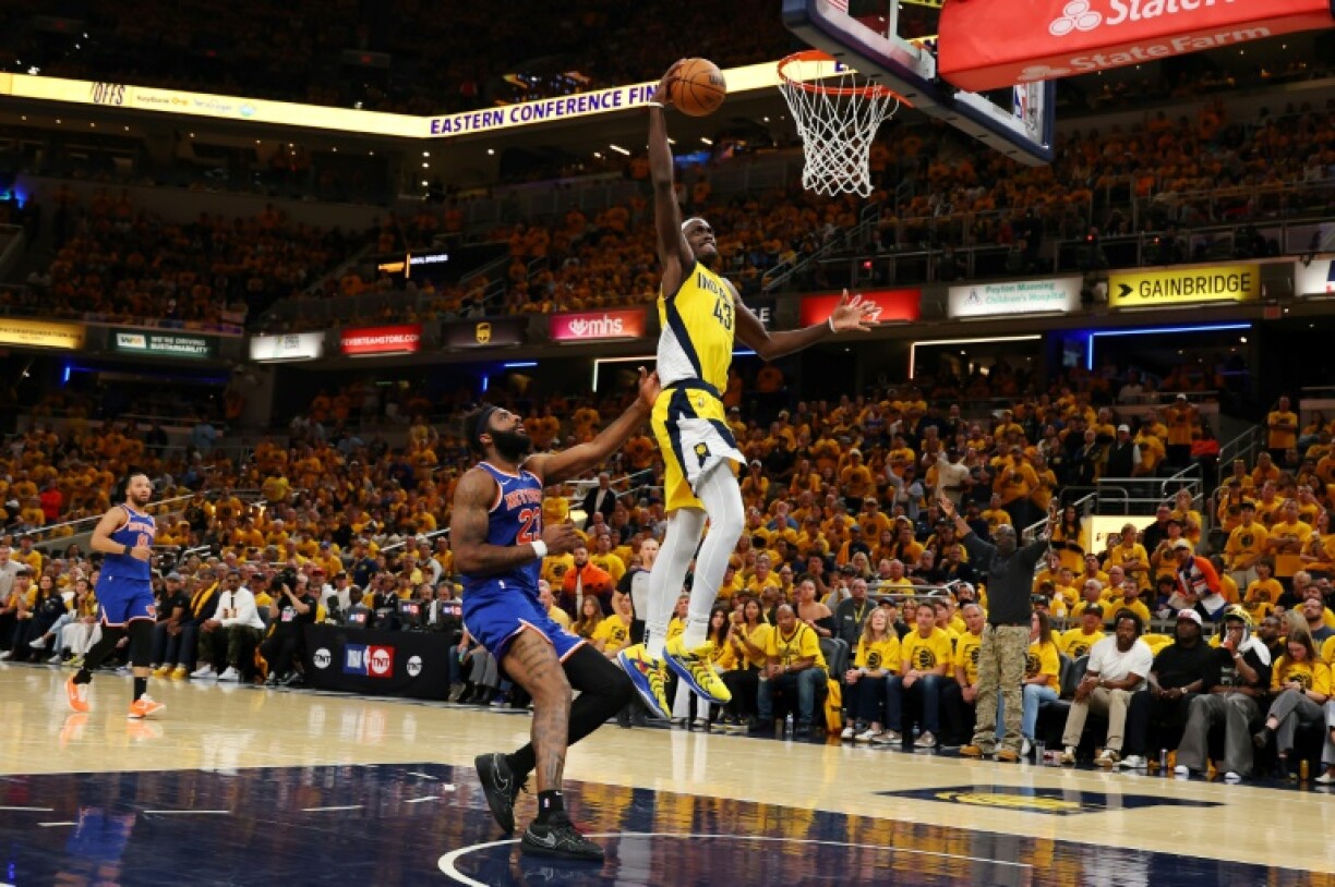 Pascal Siakam of the Indiana Pacers dunks against Mitchell Robinson in the Pacers' victory over the New York Knicks to win the NBA Eastern Conference finals