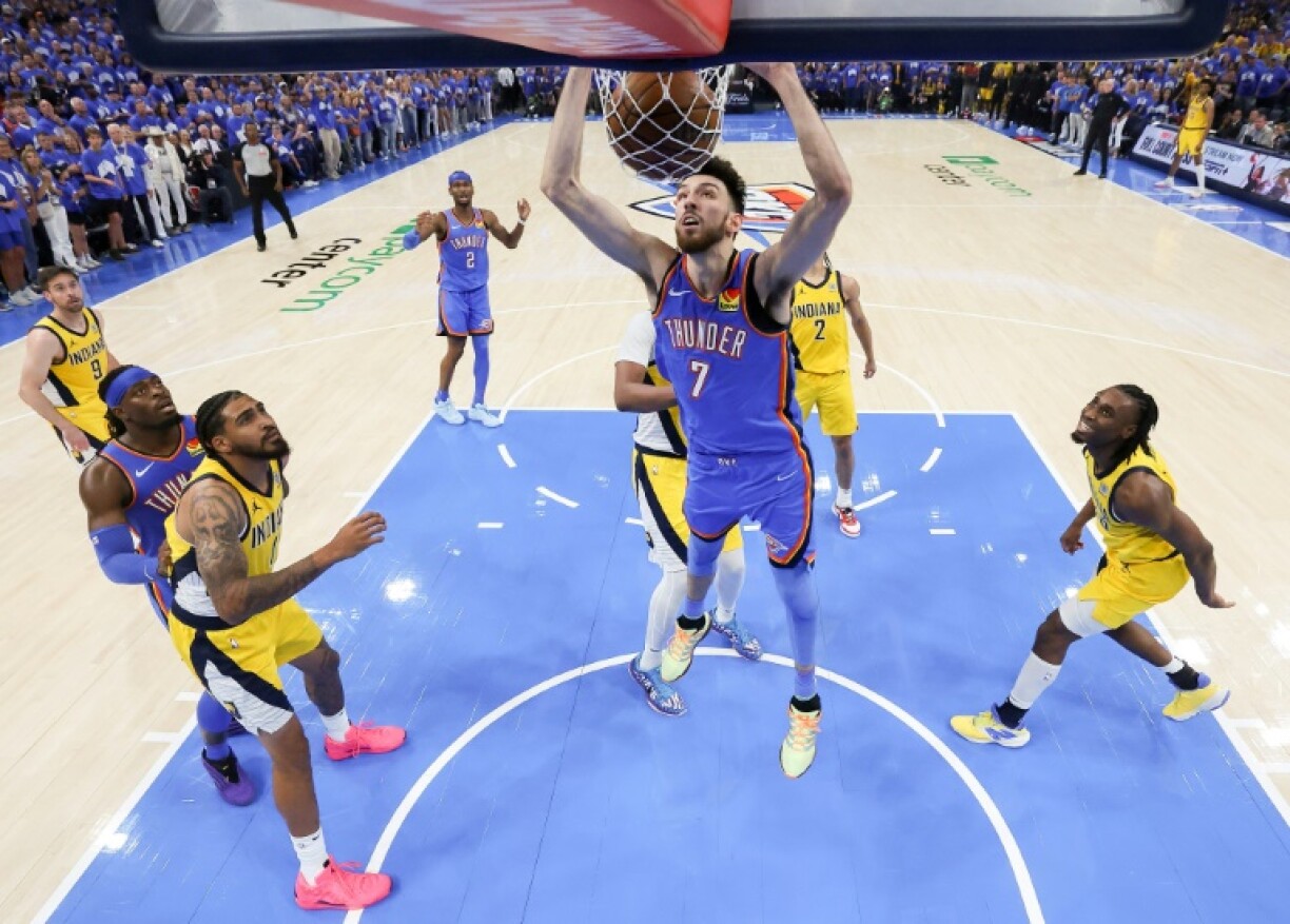 Chet Holmgren of the Oklahoma City Thunder throws down a dunk in the Thunder's NBA title-clinching victory over the Indiana Pacers in game seven of the NBA Finals
