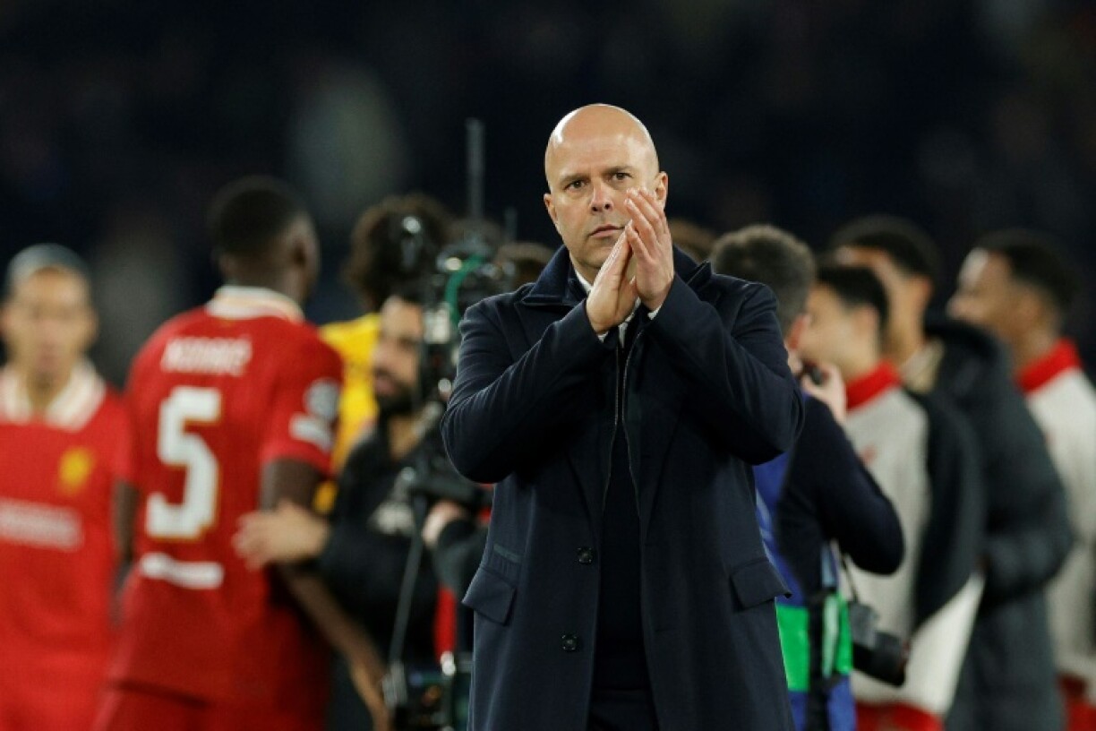Liverpool coach Arne Slot acknowledges his team's supporters at the end of their 1-0 win over PSG in the first leg of their Champions League last-16 tie