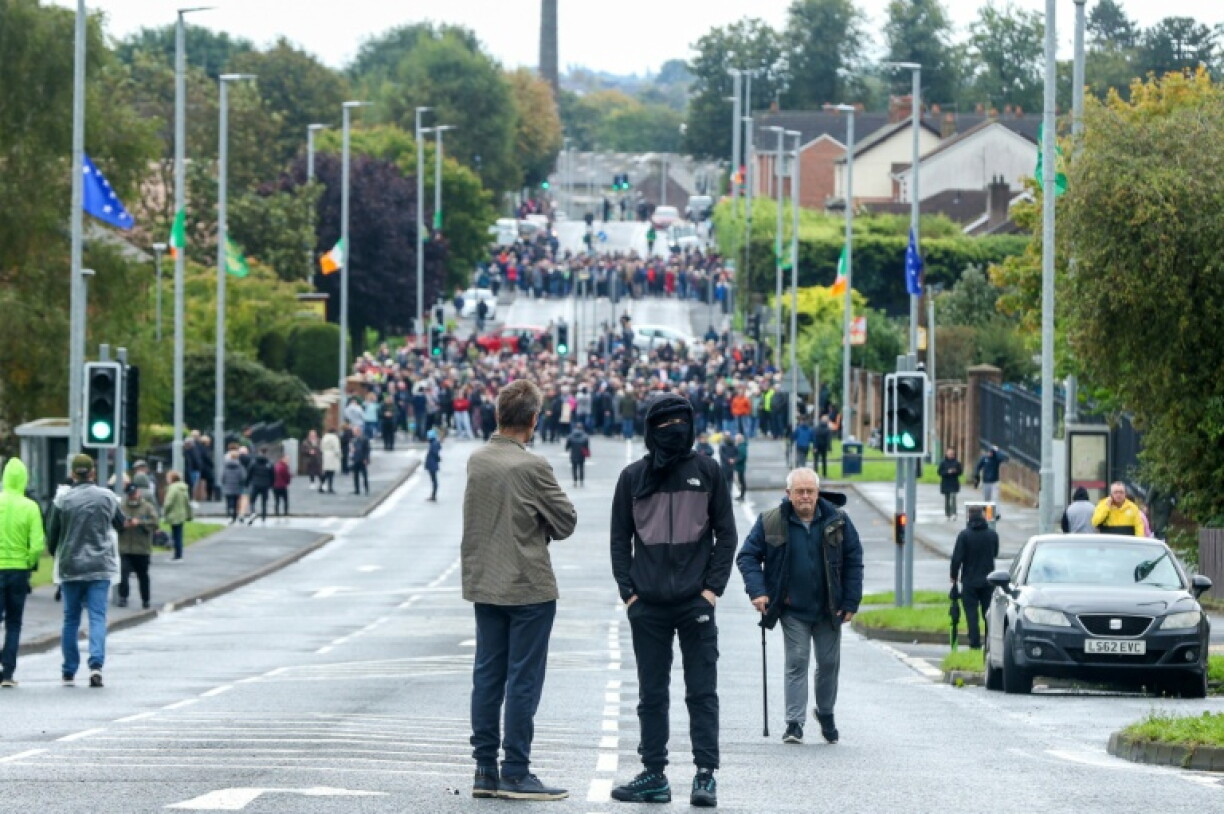 About 2,000 local residents ignored torrential rain to pack the streets and bar their path
