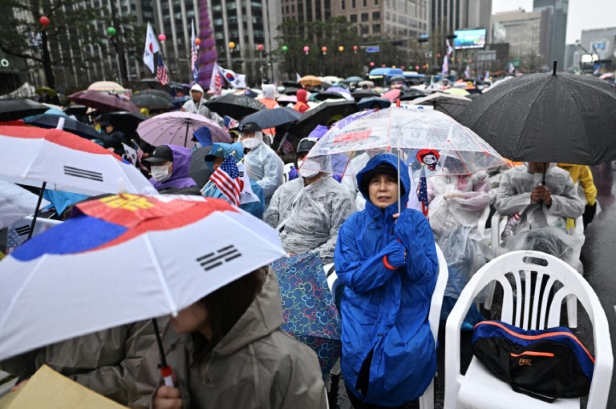 Yoon's supporters took to the streets in capital Seoul and braved the rain, chanting slogans against his removal from office
