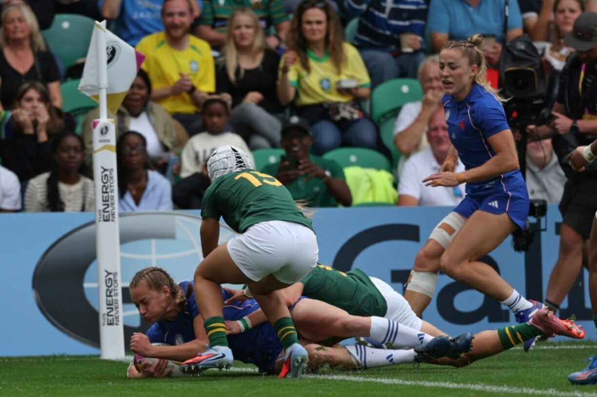 France full-back Emilie Boulard dives over the line to score the opening try of a 57-10 Women's Rugby World Cup Pool D win over South Africa in Northampton