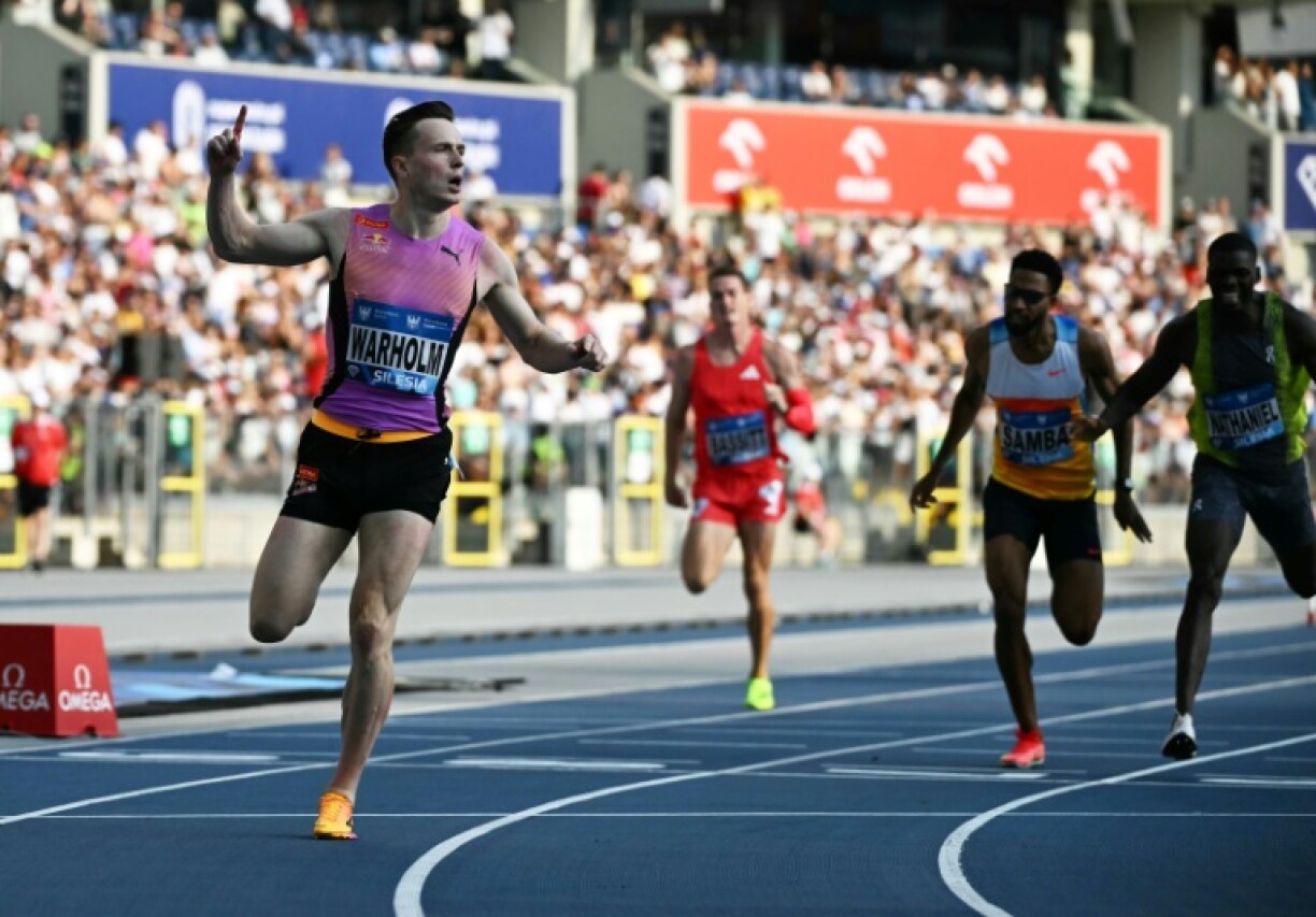Karsten Warholm (L) cruises to victory in the men's 400m hurdles at the Silesia Diamond League athletics in Poland on Saturday