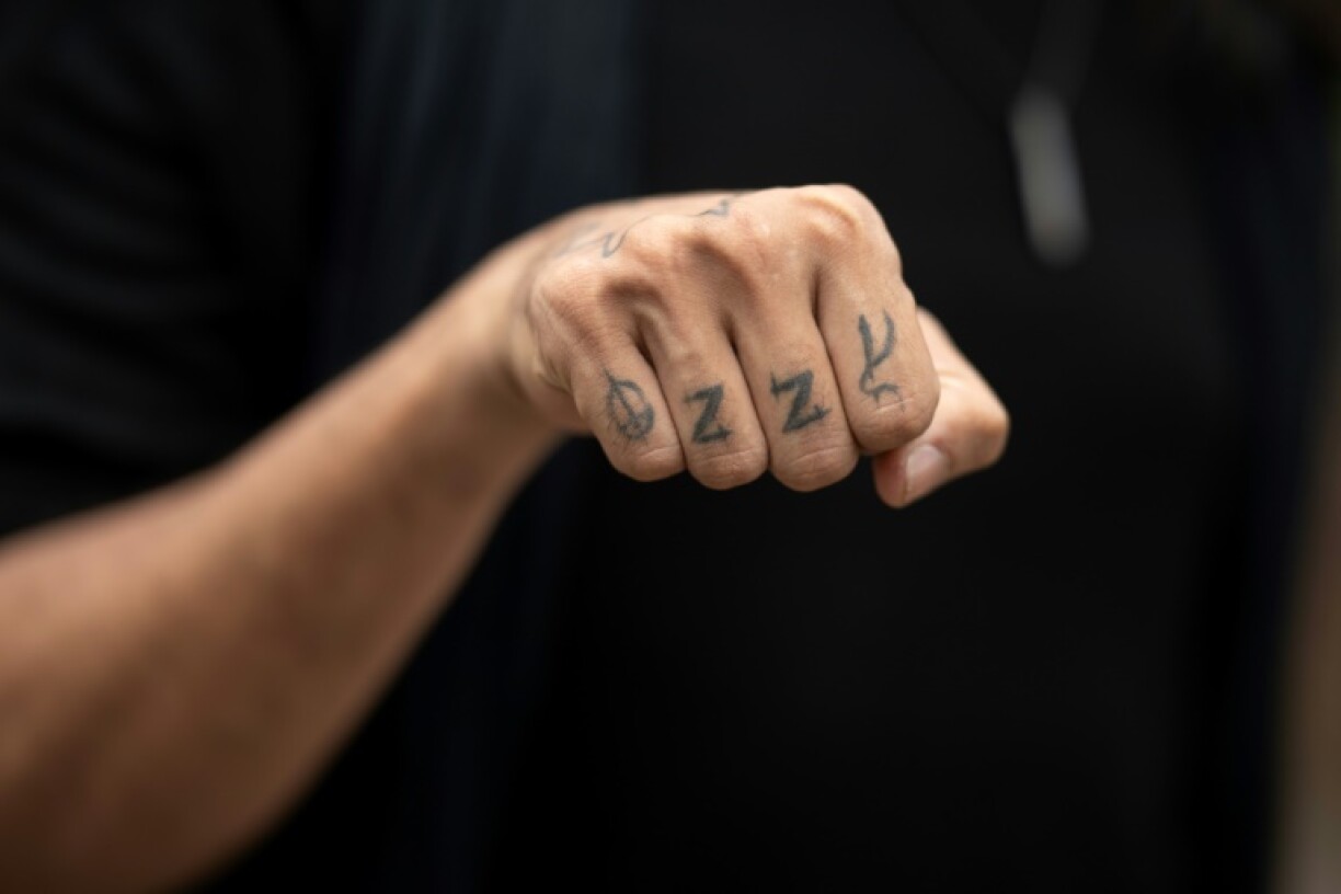 A fan with an Ozzy Osbourne tattoo arrives at Black Sabbath's 'Back to The Beginning' concert