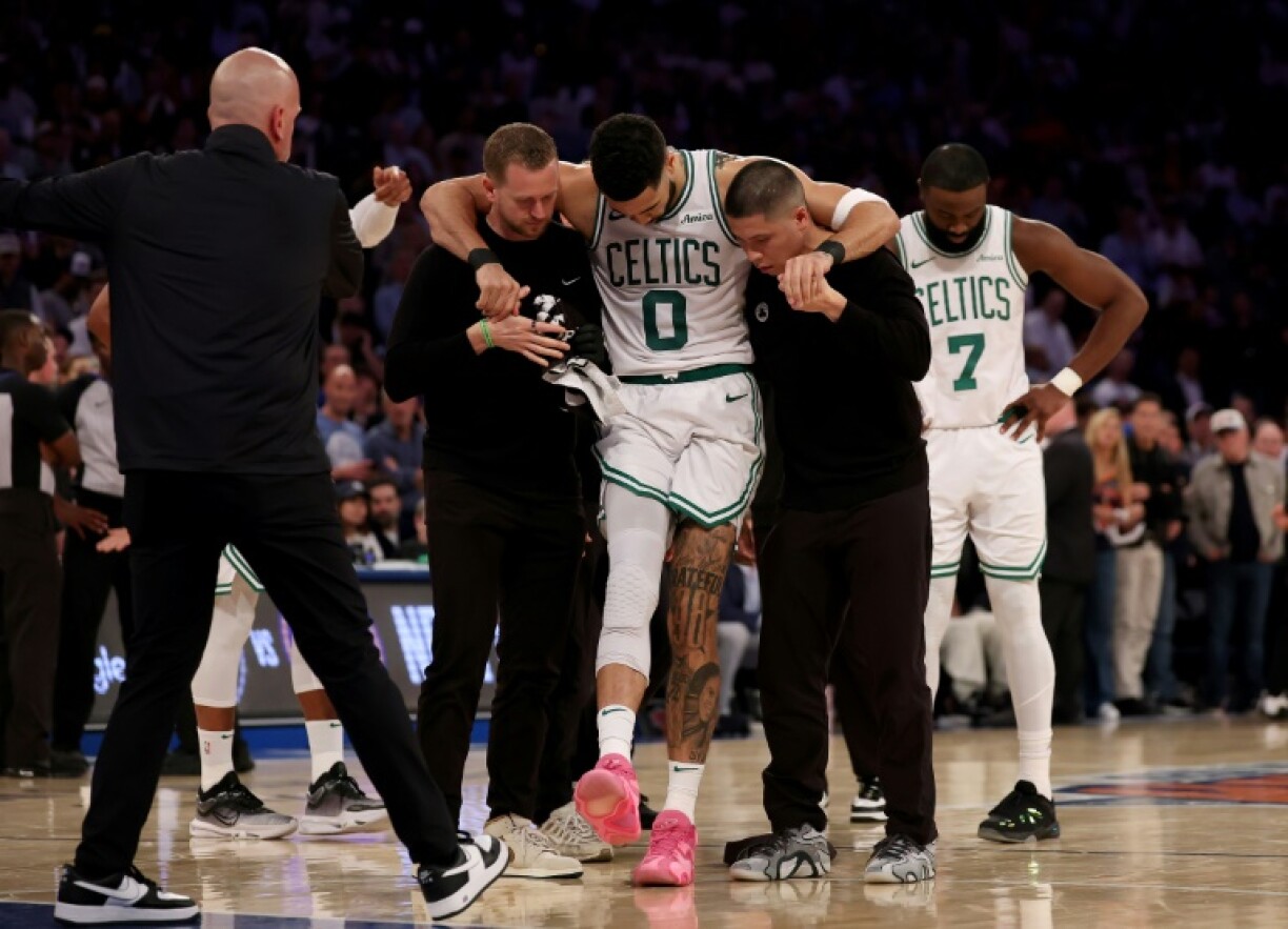 Boston Celtics star Jayson Tatum is helped off the court after rupturing his Achilles tendon in last month's playoff series with the New York Knicks