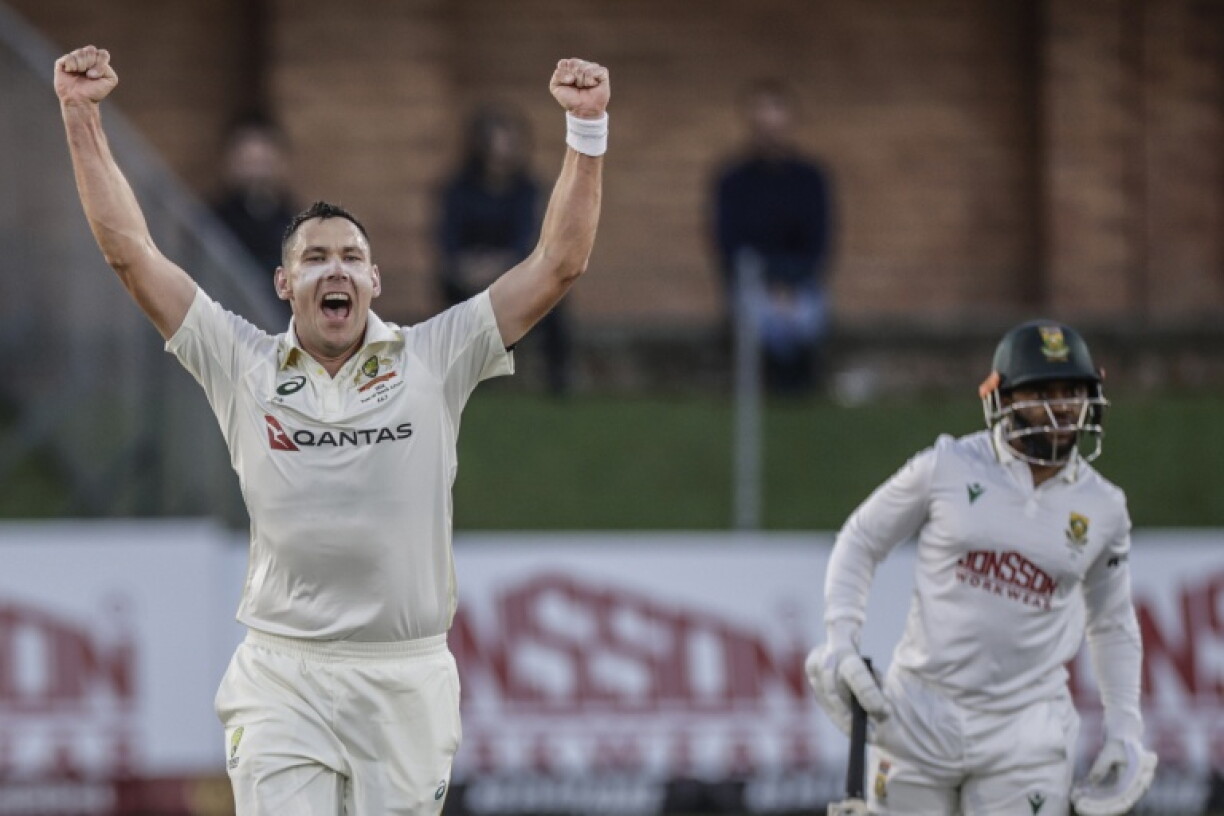 Australia's Scott Boland (L) celebrates after taking a wicket