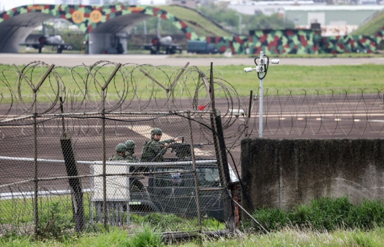 Taiwanese forces at Hsinchu air force base, as China holds military drills aimed at the self-ruled island