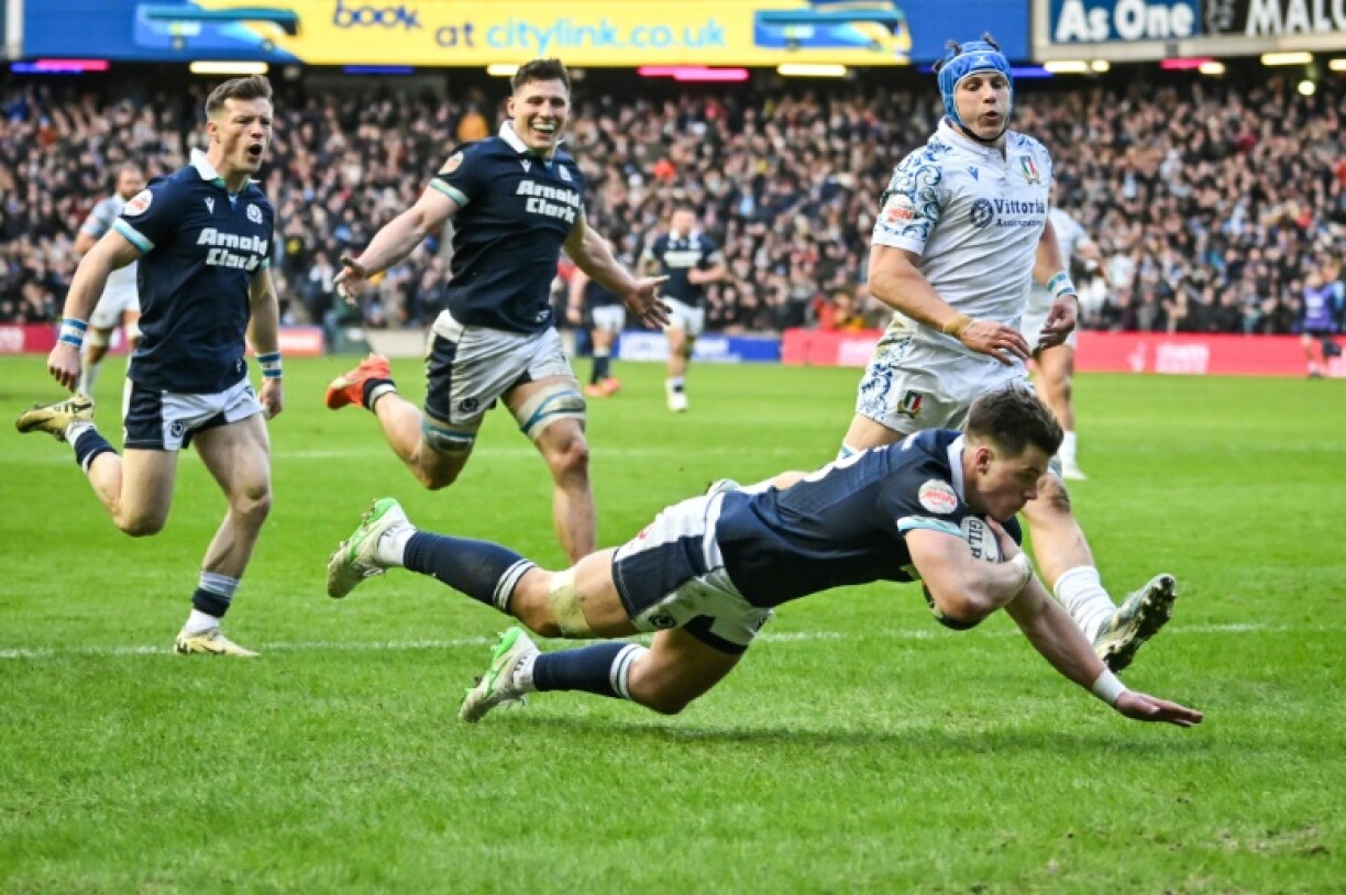 Huw Jones scores one of his three tries during Scotland's 31-19 Six Nations win over Italy at Murrayfield