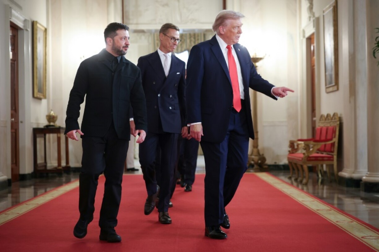 Finland's Alexander Stubb (centre), who has befriended Trump playing golf, was part of the European delegation