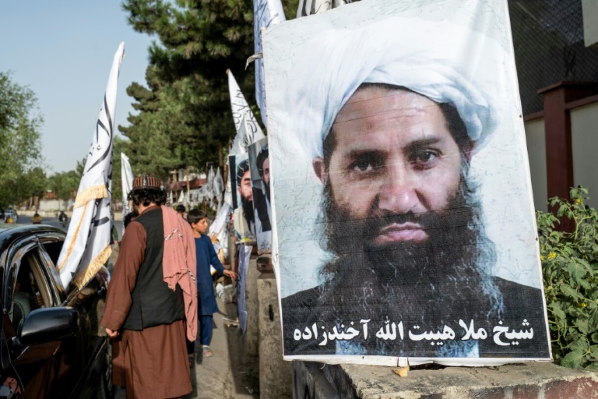A poster of Taliban Supreme Leader Hibatullah Akhundzada is seen along a road in Kabul on August 14, 2023