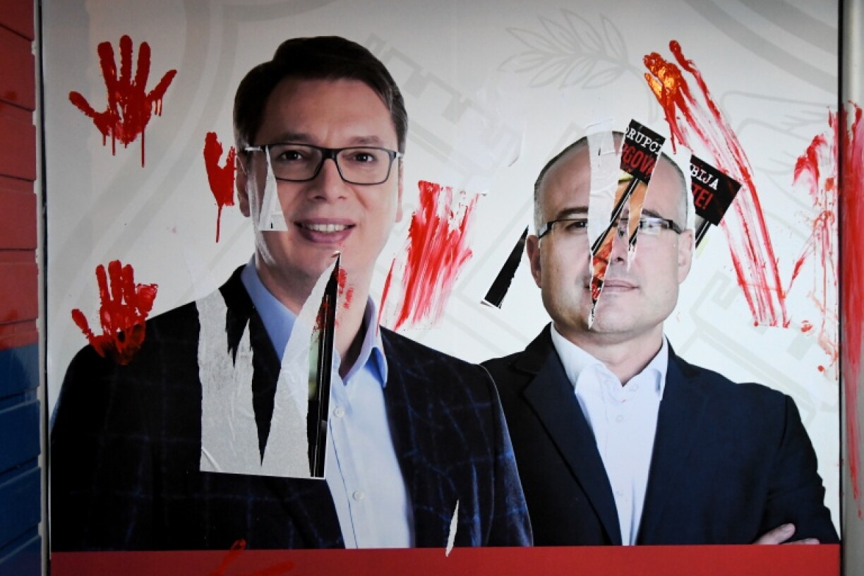 Vandalised portraits of President Aleksandar Vucic and Prime Minister Milos Vucevic during a protest in Novi Sad