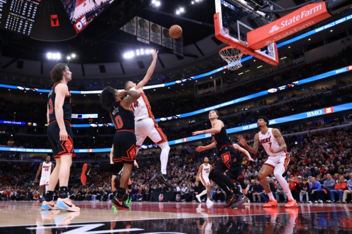 Miami's Tyler Herro shoots over Chicago's Coby White on his way to 38 points in a 109-90 play-in victory
