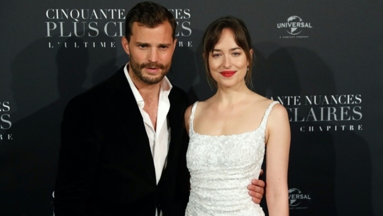 Den Jamie Dornan an d'Dakota Johnson bei der Presentatioun vu