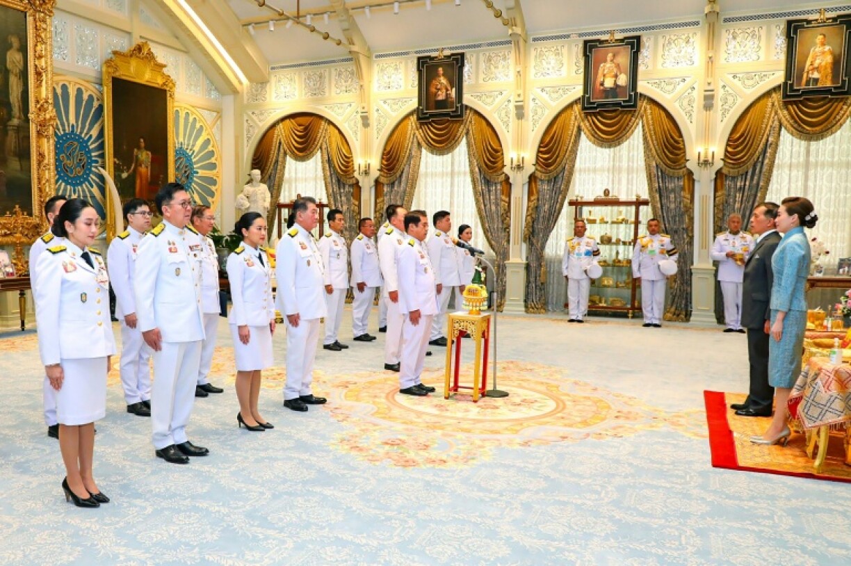 Thailand's king swore in a new cabinet after a court decision plunged the nation's top office into turmoil