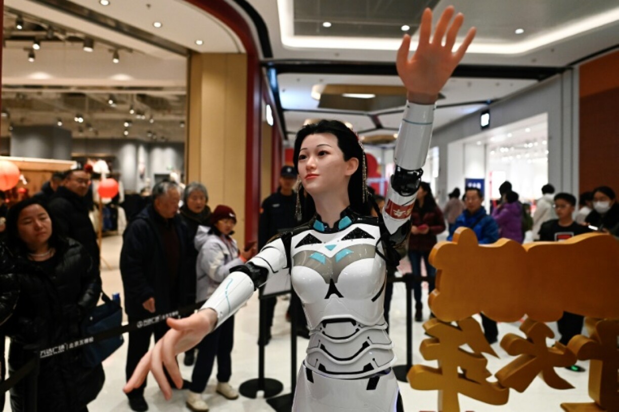 A dancing humanoid robot gyrates to music at a fair in Beijing during China's week-long Lunar New Year holidays