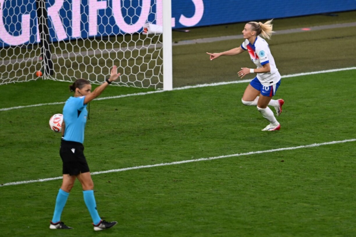 England forward Chloe Kelly celebrates after scoring the winning penalty in the UEFA Women's Euro 2025 final