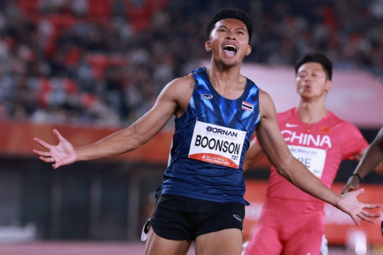 Thailand's Puripol Boonson crosses the finish line to win the men's 100m final
