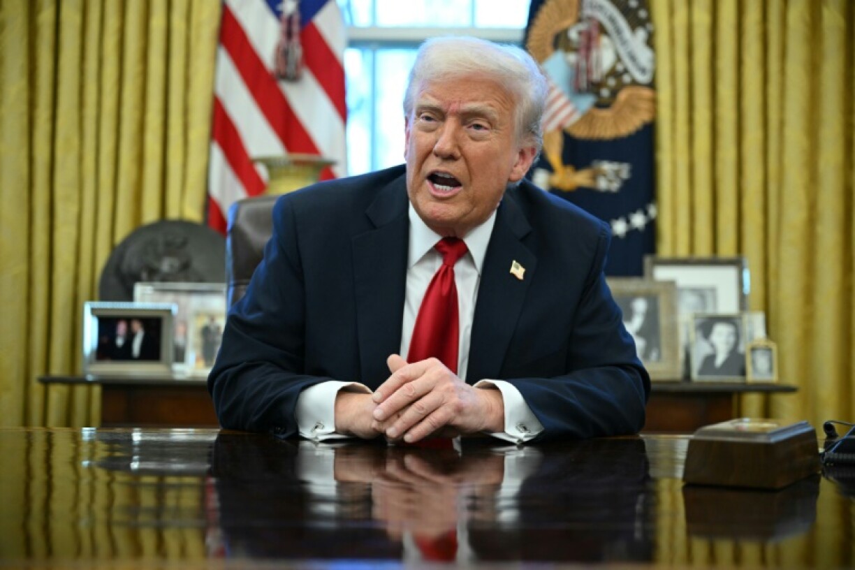 Trump spoke to reporters in the Oval Office after signing an order to enact sweeping tariffs on car imports