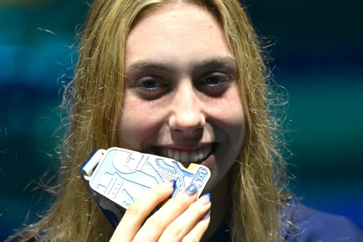 Taste for success: Gretchen Walsh poses with her medley gold medal