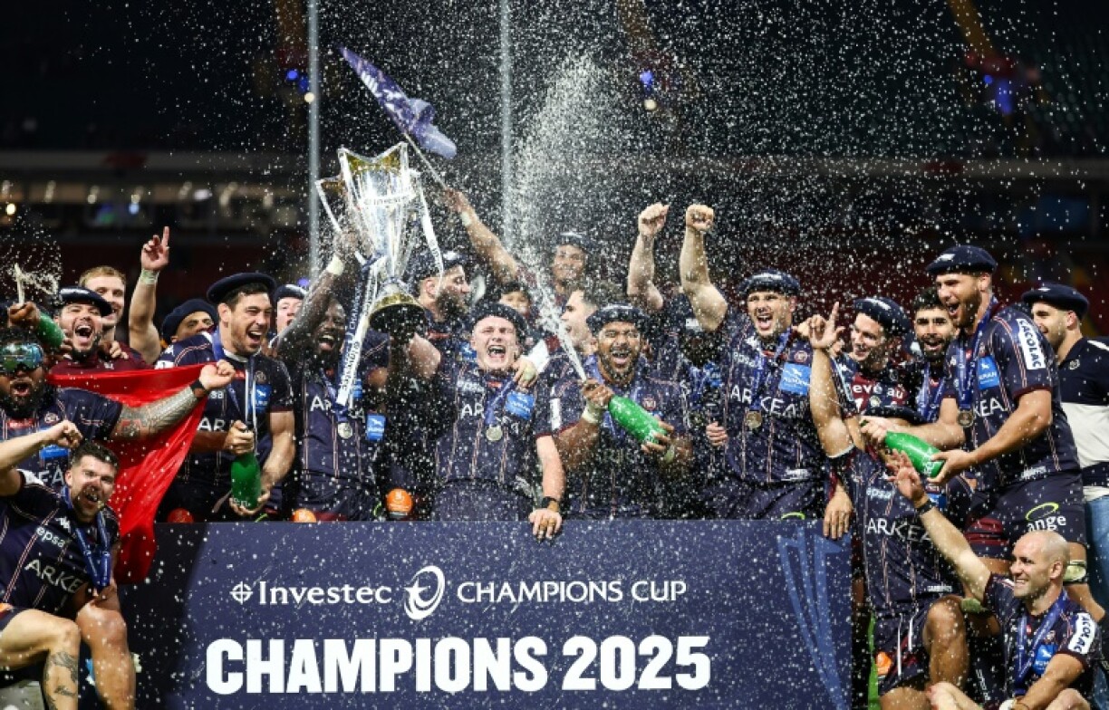 Bordeaux-Begles' celebrate with the Champions Cup trophy