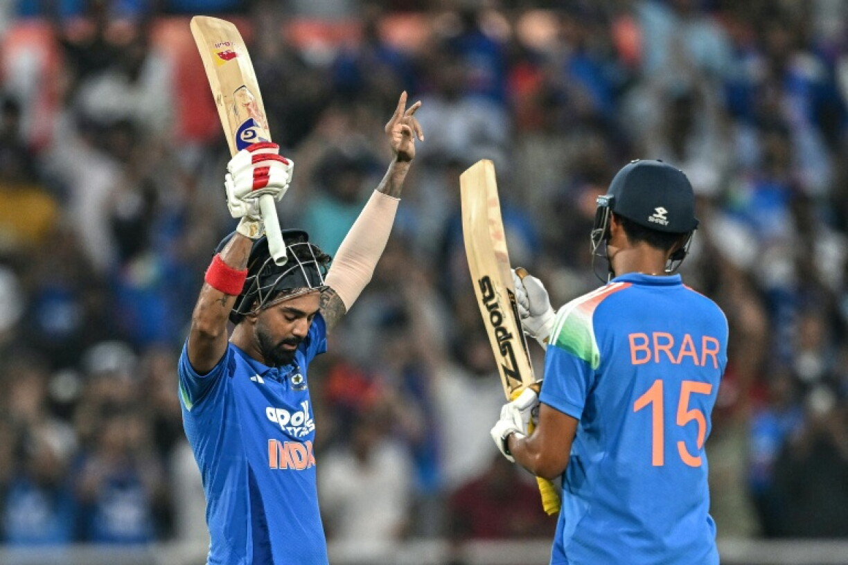 India's KL Rahul (L) celebrates after scoring a century