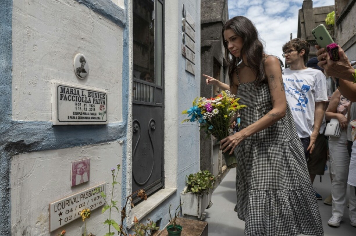 Visitor Mirella Rabello places flowers at Eunice Paiva's tomb in Araca cemetery, Sao Paulo, Brazil