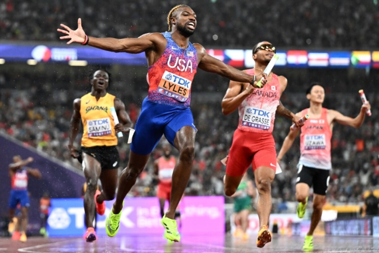 Noah Lyles (C) anchored the USA 4x100 metre relay team to gold at the World Athletics Championships in Tokyo