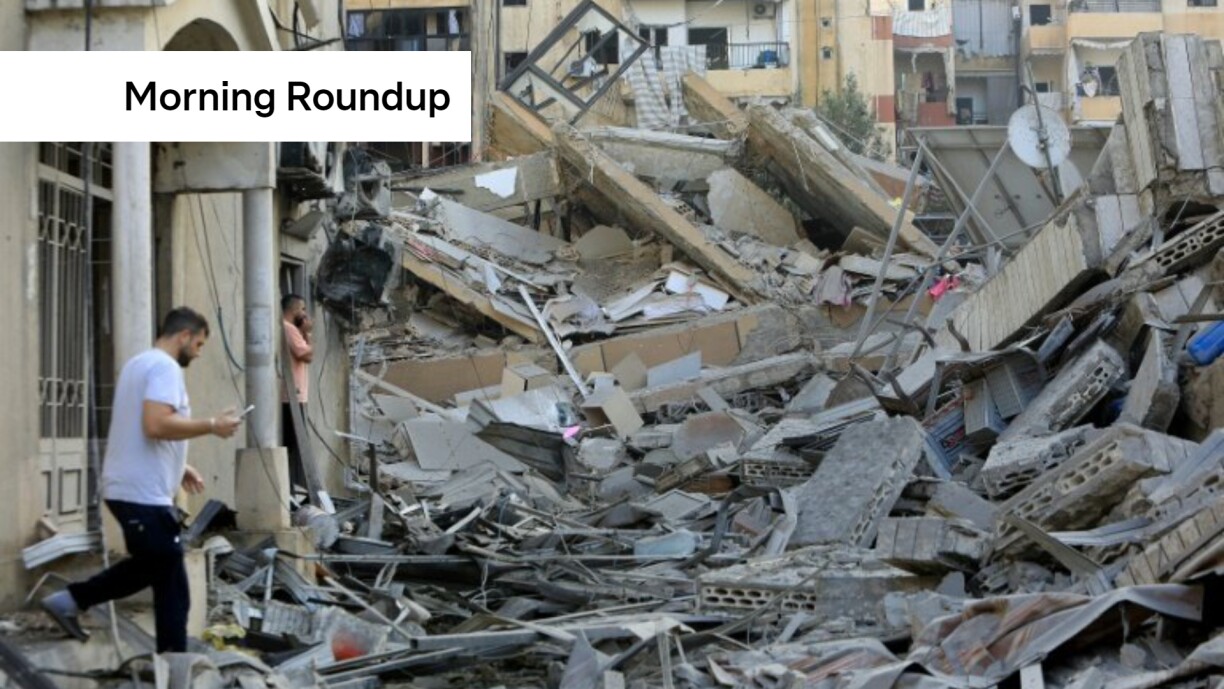 A man walks amid the devastation after an Israeli strike on the Sfeir neighbourhood in Beirut’s southern suburbs / © AFP