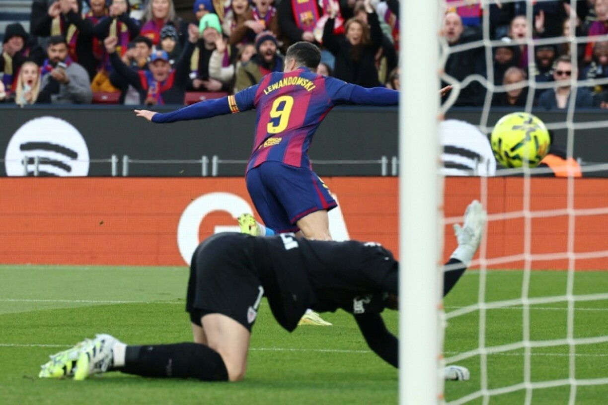 Robert Lewandowski celebrates scoring the opening goal in the win over Athletic Bilbao in the first game back at Camp Nou