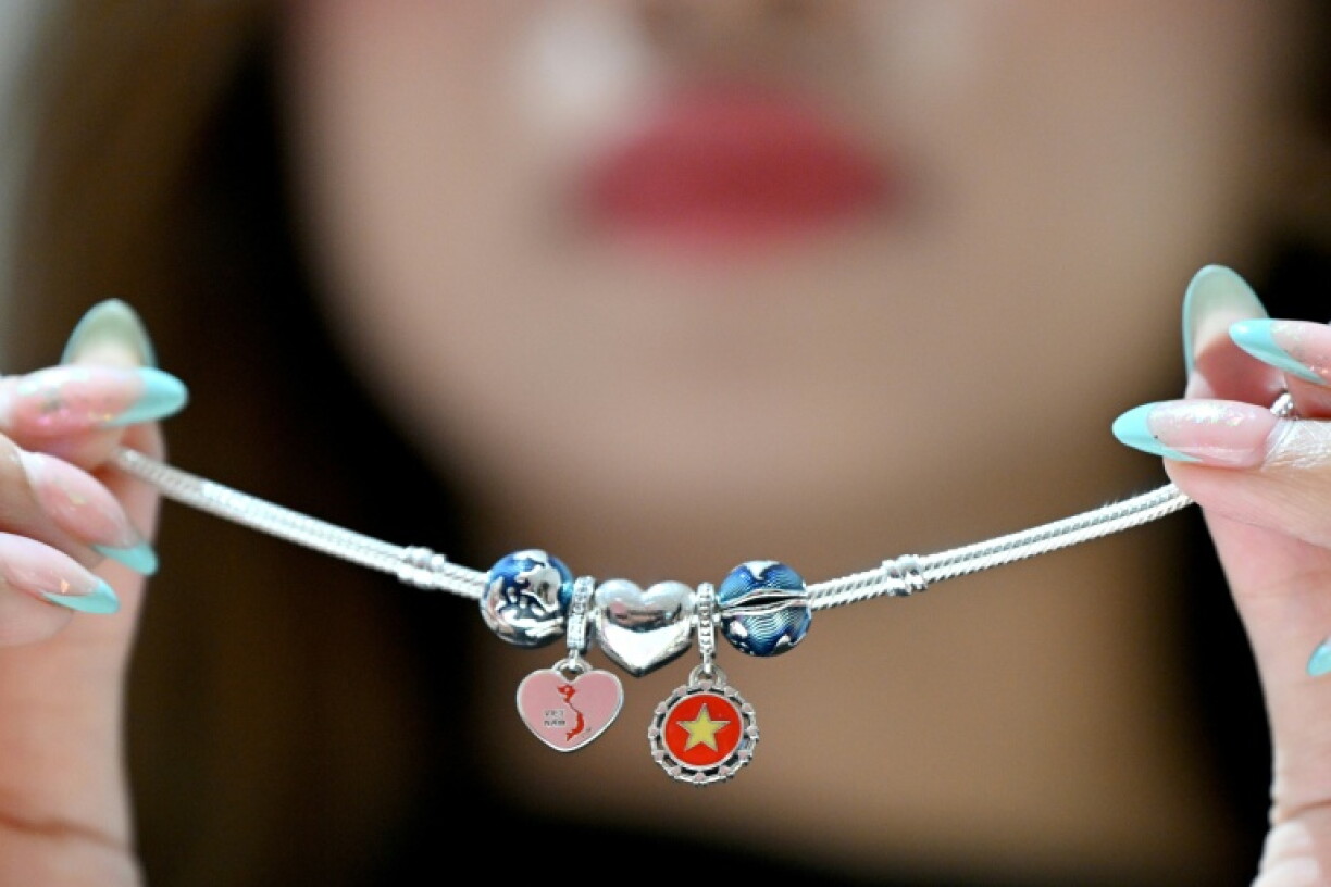 Pandora opened its first Vietnam plant by showing off bracelet charms featuring the country's national flag and a bowl of pho noodle soup